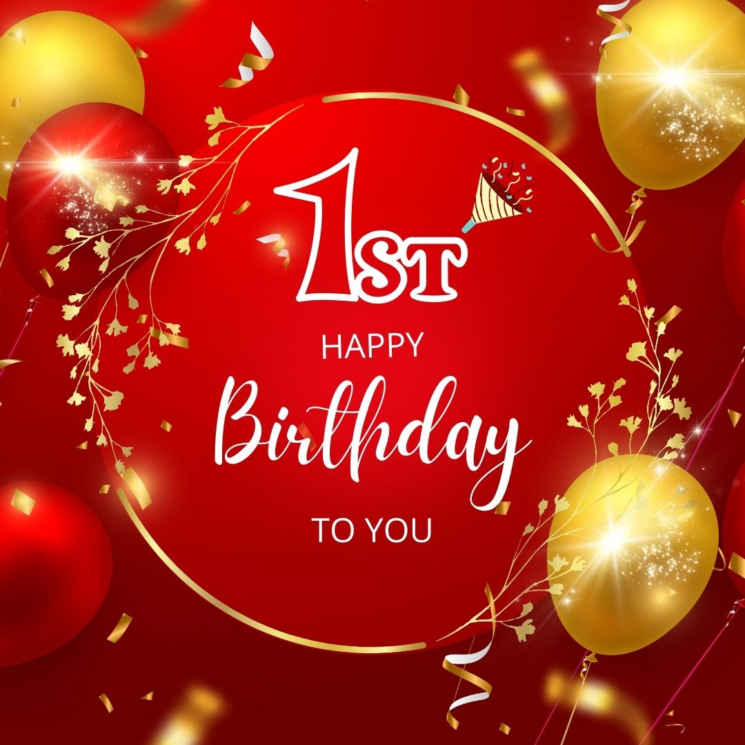 A festive 1st birthday greeting card with the message "happy 1st birthday to you" in white text surrounded by red and gold balloons, gold confetti, and streamers on a red