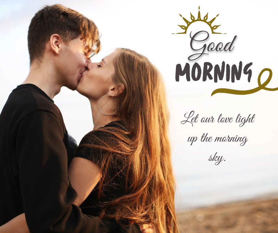 Romantic Good Morning Kiss Image showcasing a young couple deeply kissing at dawn with the serene backdrop of a calm sea. The man and woman, dressed casually in black, are highlighted by the golden sunrise. The image is adorned with the caption 'Good Morning - Let our love light up the morning sky,' adding a poetic touch.