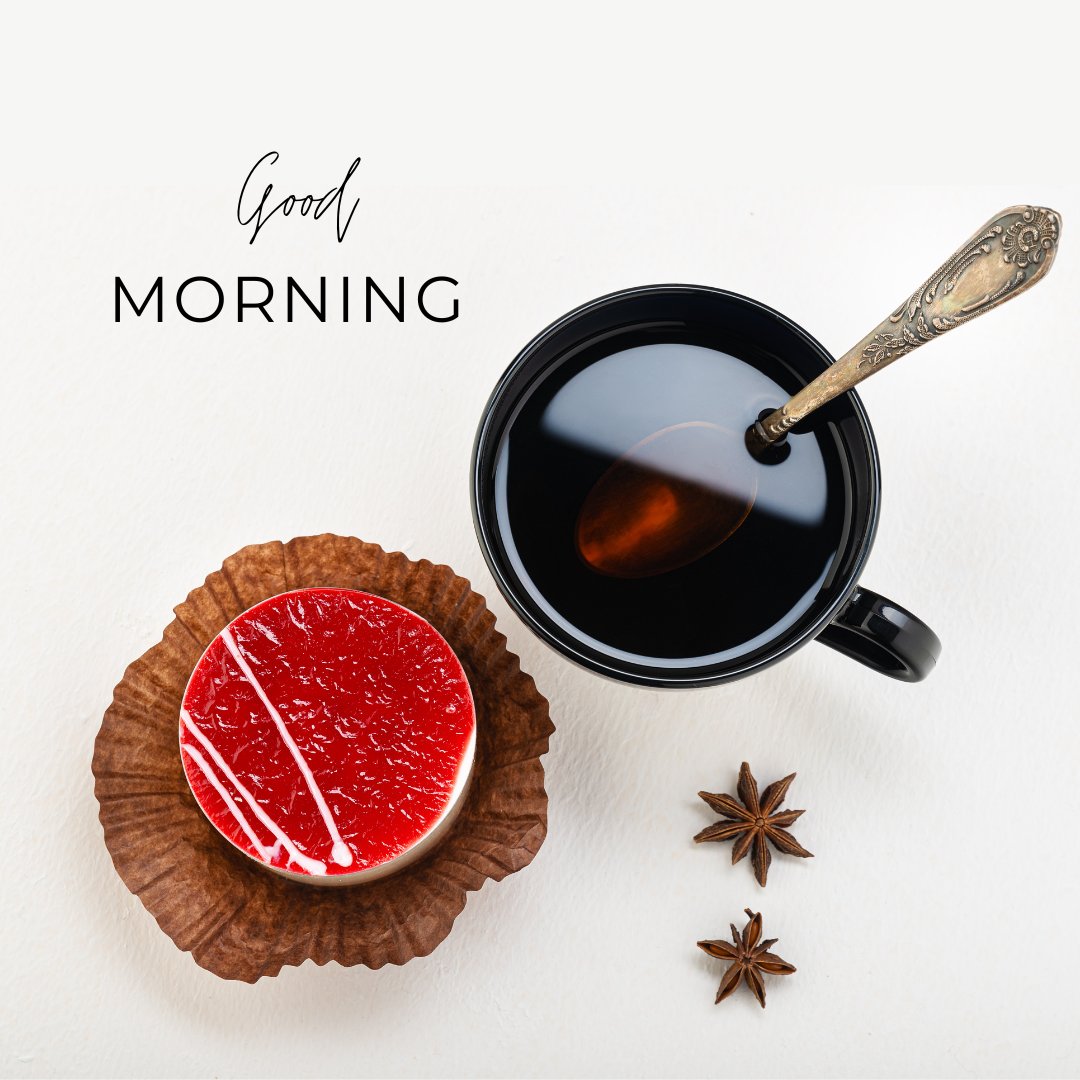 Good morning tea image depicting an elegant black tea cup with a vintage silver spoon, accompanied by a vibrant red grapefruit tart on a rustic paper liner and star anise spices, all set against a crisp white background with the greeting "Good Morning."