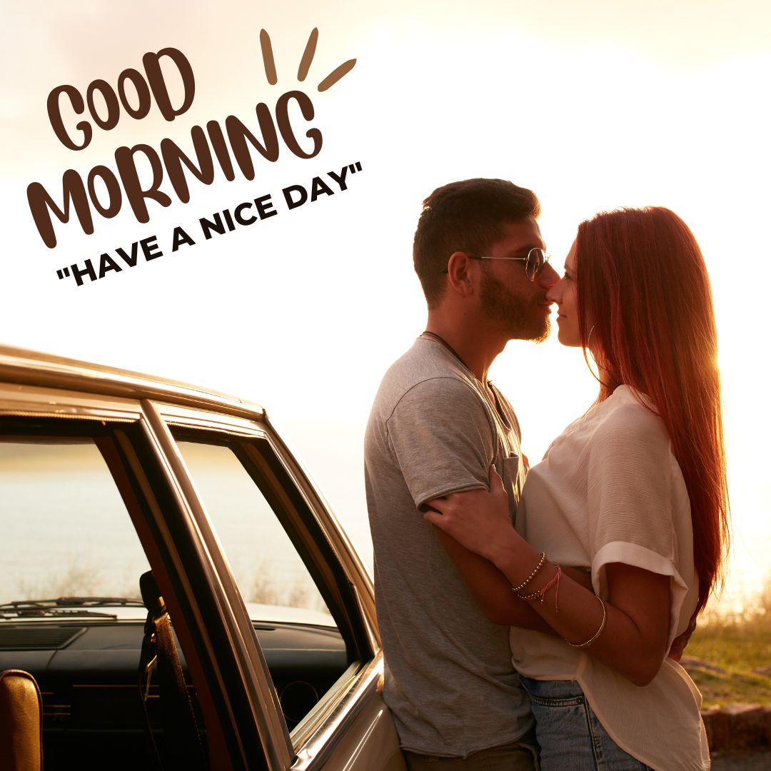 A romantic couple shares a gentle morning kiss near a vintage car, with a warm sunrise in the background and 'GOOD MORNING' text wishing a nice day.